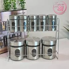 طقم توابل وكانستر ستانلس ستيل مع حامل معدني (8 قطع).